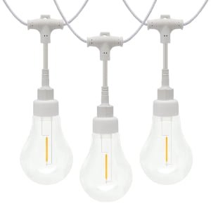 Modular commercial A19 LED string lights with waterproof twist-on connectors on white wire