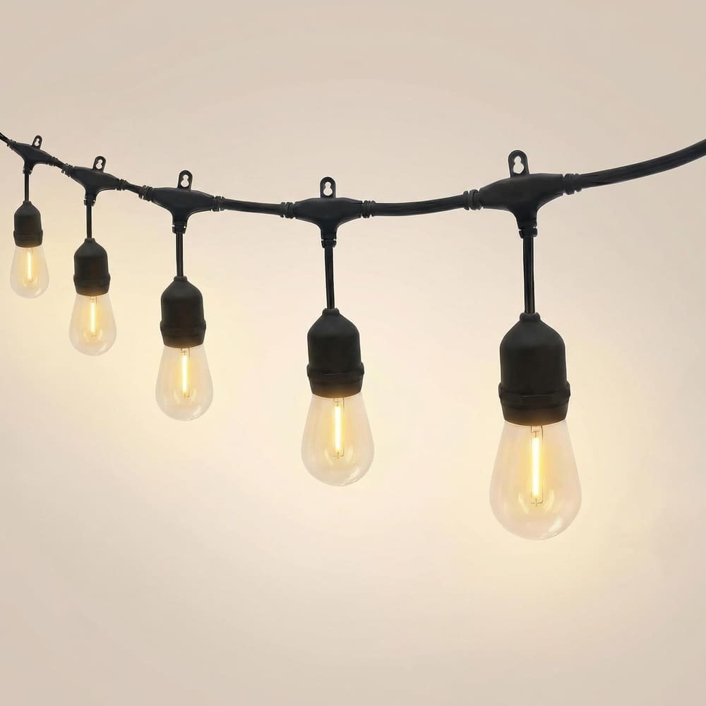 Heavy-duty commercial string lights featuring suspended S14 LED filament bulbs on black wire