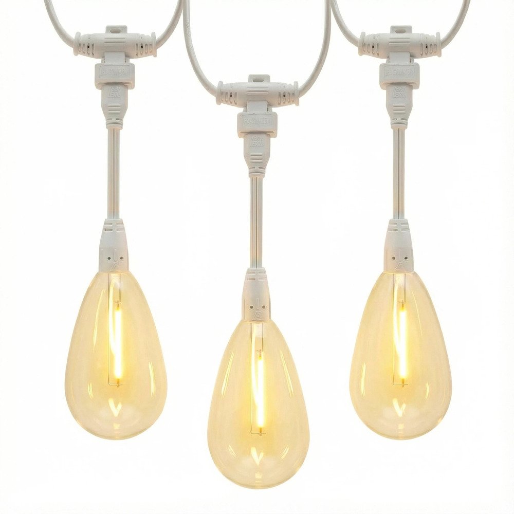 Close-up of white commercial grade string lights featuring warm S14 LED filament bulbs