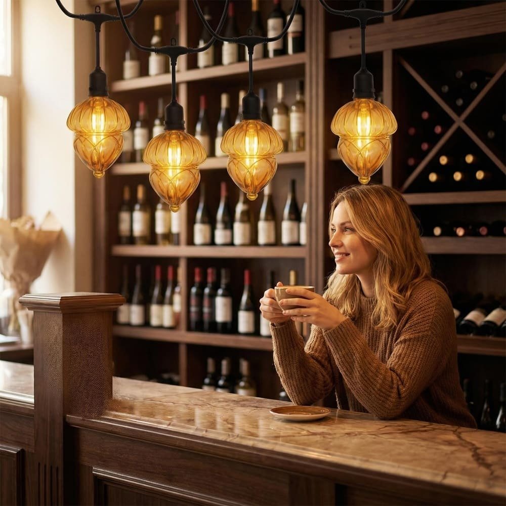 Vintage amber gourd LED string lights adding warm ambiance to a cafe counter