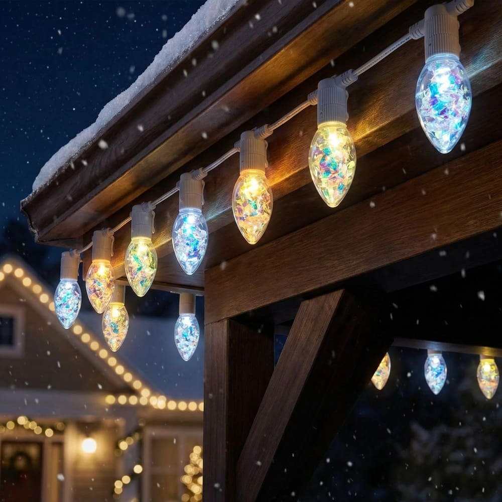 Weather-resistant holographic C9 LED string lights hanging on roof eaves during winter snowfall