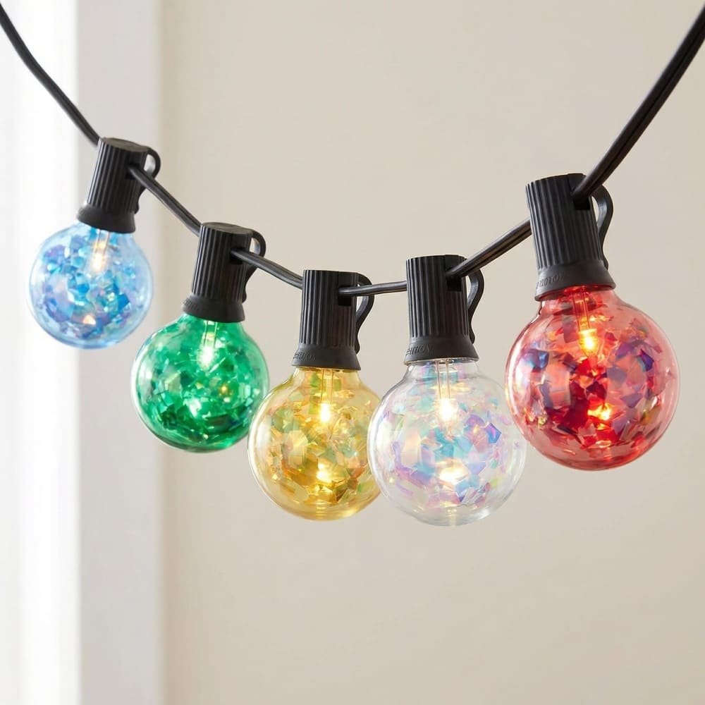Close-up of colorful G40 LED string lights with sparkling holographic filament effect